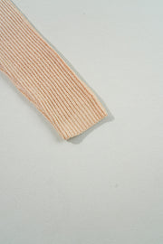 Warm apricot knit sweater styled for casual daily wear