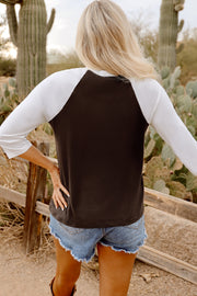 Yeehaw graphic top showing raglan sleeves and crew neckline