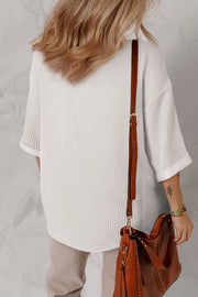 White 3/4 sleeve top with folded cuffs and textured ribbing