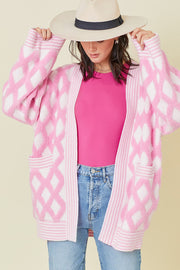 Rhombus knit cardigan showing relaxed drop-shoulder long sleeves
