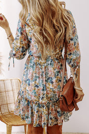 Floral V-neck dress featuring 3/4-length sleeves and ruffle hem