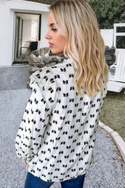 Bow Knot Print Blouse showing ruffled mock neckline detail