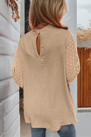 Swiss dot balloon sleeve blouse detail of soft draping polyester
