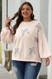 Feminine pink lantern sleeve sweatshirt styled for everyday casual wear