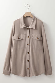Plus size shacket showing side slits and functional side pockets