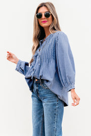 Puff sleeve denim top with flowy shift silhouette and bracelet-length sleeves