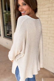 Waffle knit V-neck top showing relaxed loose shift silhouette
