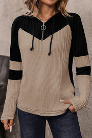 Long sleeve quarter zip hooded top with stretchy knit for everyday wear