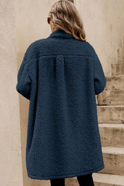 Teddy coat detail showing chic contrast flap pockets