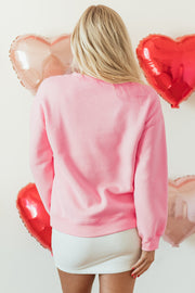 Pink LOVER sweatshirt showing drop-shoulder loose shift silhouette